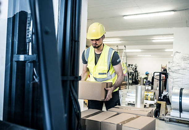 Worker handling boxes